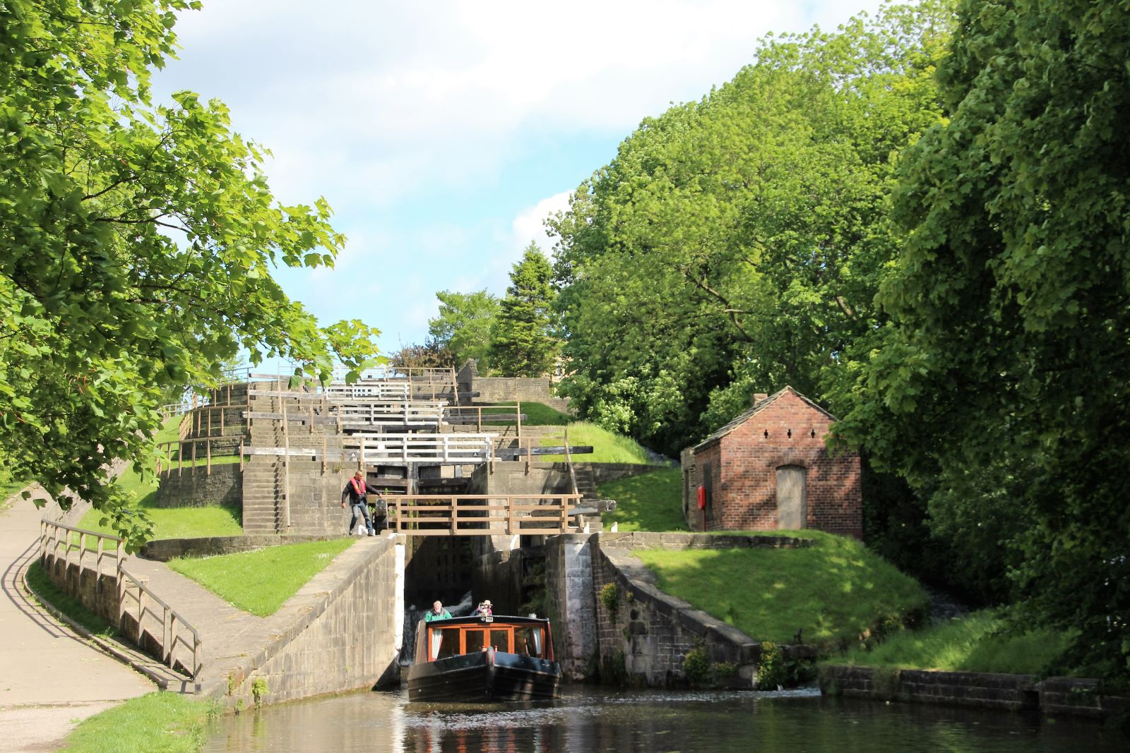 Travel through the Bingley Five Rise locks on a canal boat holiday
